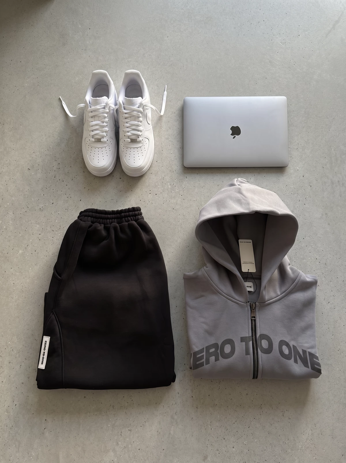 Zero to One product flatlay with sneakers and hoodie